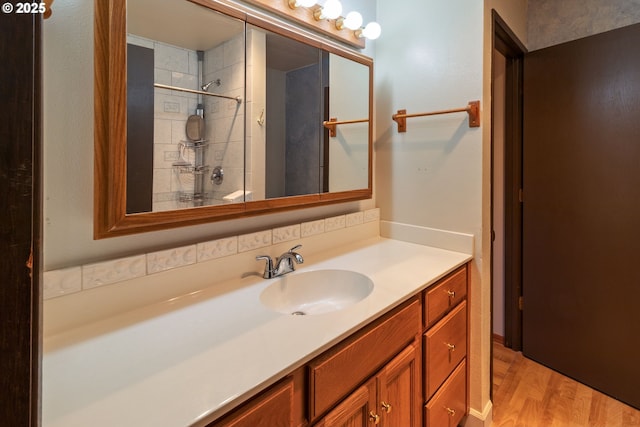 full bathroom with wood finished floors and vanity