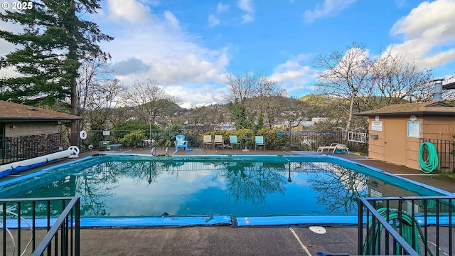 community pool featuring fence