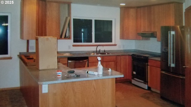 755735 Bluff Ave, Bandon, OR 97411 - kitchen with high end fridge, electric stove, exhaust hood, a sink, and stainless steel dishwasher