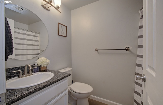 bathroom featuring vanity, toilet, and hardwood / wood-style floors