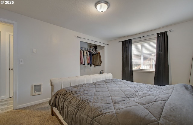 carpeted bedroom featuring a closet