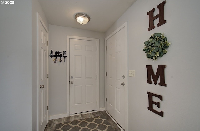 doorway with hardwood / wood-style flooring