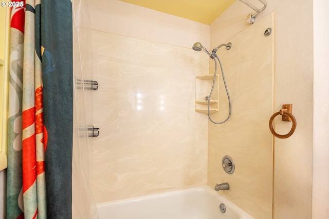 bathroom with shower / bathtub combination with curtain