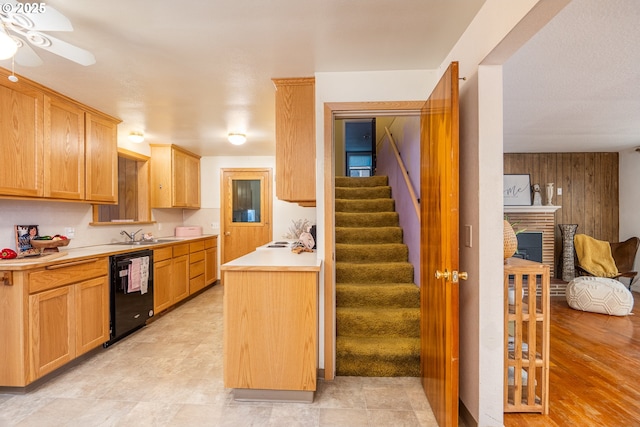 4160 Willhi St, Eugene, OR 97402 - kitchen with dishwasher, ceiling fan, light brown cabinetry, a fireplace, and wooden walls