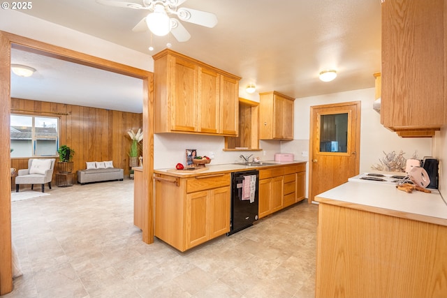 4160 Willhi St, Eugene, OR 97402 - kitchen featuring sink, black dishwasher, stove, wood walls, and ceiling fan