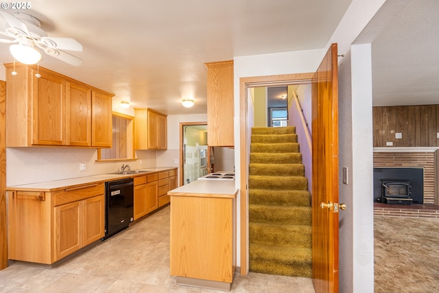 kitchen with sink, cooktop, black dishwasher, and ceiling fan