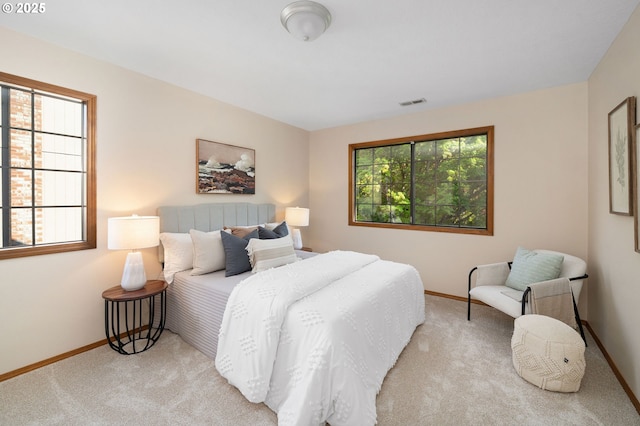 bedroom with visible vents, baseboards, and carpet floors