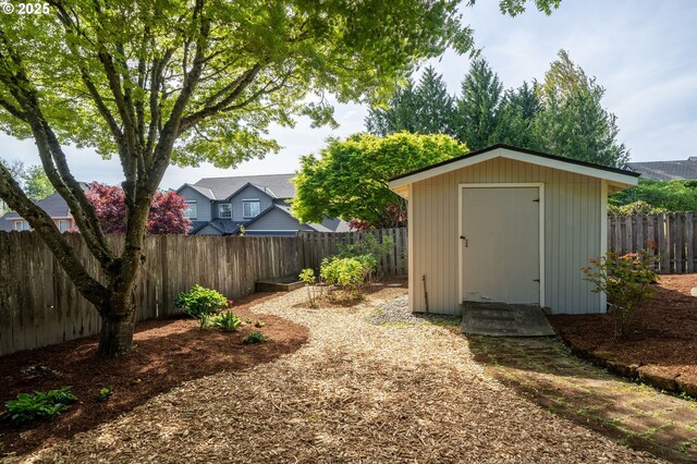 view of shed with a fenced backyard