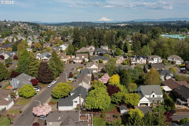 birds eye view of property with a residential view and a mountain view