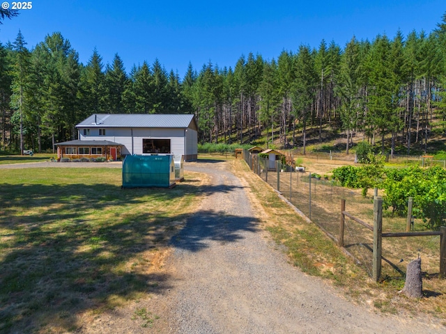 94986 Thetford Ln, Marcola, OR 97454 - view of dirt / gravel driveway with a wooded view