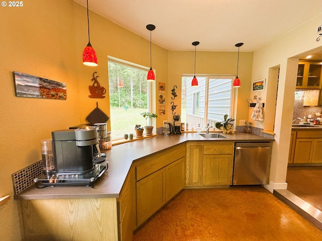 94986 Thetford Ln, Marcola, OR 97454 - kitchen with stainless steel dishwasher, decorative backsplash, a sink, and decorative light fixtures