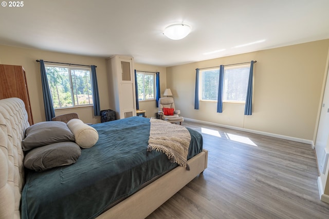 94986 Thetford Ln, Marcola, OR 97454 - bedroom featuring wood finished floors and baseboards