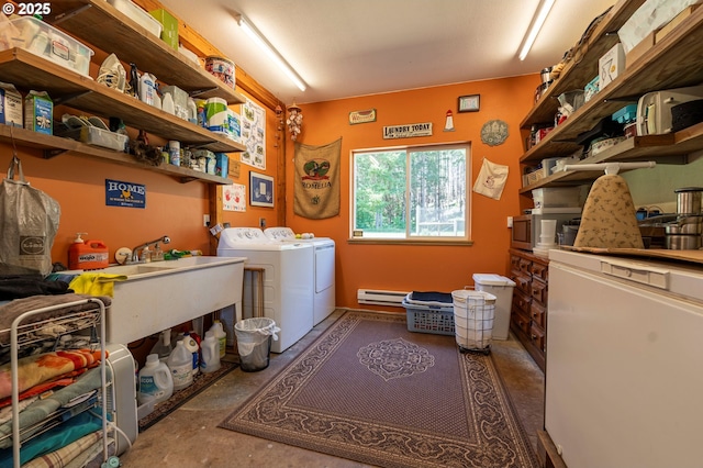 94986 Thetford Ln, Marcola, OR 97454 - laundry room with washer and clothes dryer and a baseboard radiator