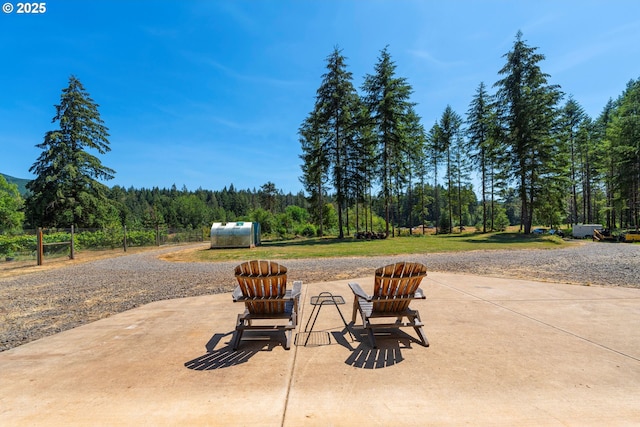 94986 Thetford Ln, Marcola, OR 97454 - view of patio / terrace featuring a view of trees and fence