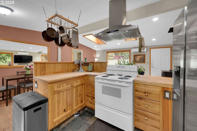 86680 Territorial Hwy, Veneta, OR 97487 - kitchen with white electric stove, island range hood, stainless steel refrigerator with ice dispenser, a wall mounted AC, and recessed lighting