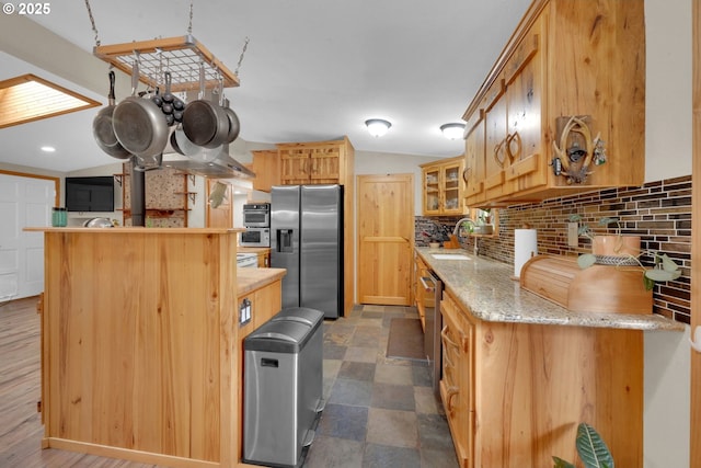 86680 Territorial Hwy, Veneta, OR 97487 - kitchen featuring stainless steel appliances, tasteful backsplash, a sink, glass insert cabinets, and vaulted ceiling
