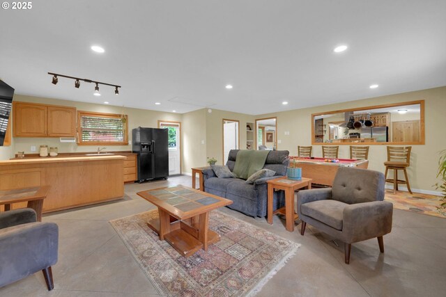 86680 Territorial Hwy, Veneta, OR 97487 - living room with finished concrete floors, attic access, billiards table, baseboards, and recessed lighting