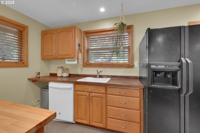 86680 Territorial Hwy, Veneta, OR 97487 - kitchen featuring black refrigerator with ice dispenser, white dishwasher, a sink, wood counters, and recessed lighting