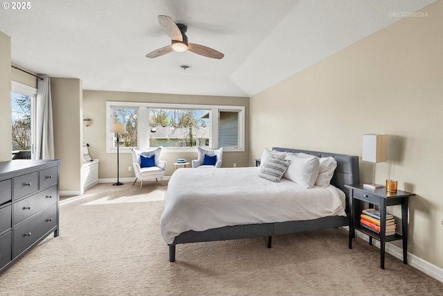 bedroom featuring light carpet, ceiling fan, and baseboards