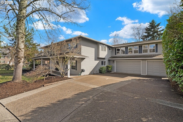 view of front of property featuring a garage, covered porch, and driveway