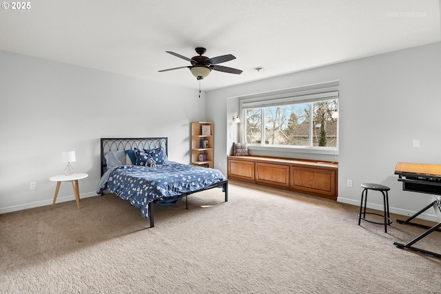 bedroom featuring baseboards, a ceiling fan, and light colored carpet