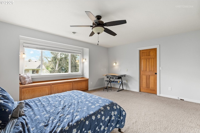 bedroom featuring a ceiling fan, light carpet, visible vents, and baseboards