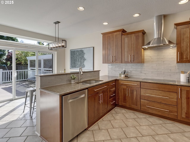kitchen featuring wall chimney exhaust hood, dishwasher, a sink, decorative backsplash, and recessed lighting