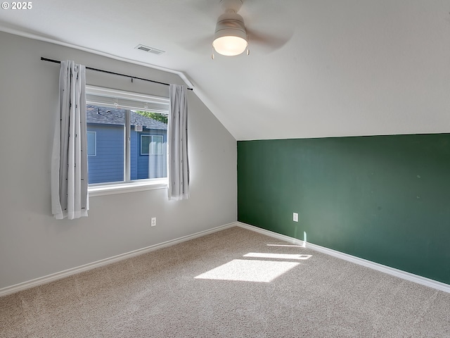bonus room featuring vaulted ceiling, ceiling fan, carpet floors, and baseboards