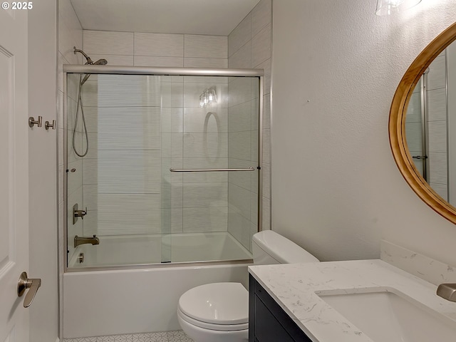 bathroom with toilet, combined bath / shower with glass door, and vanity