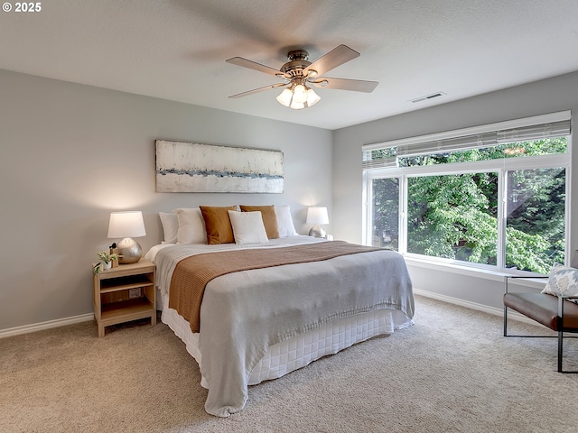 bedroom featuring carpet flooring, baseboards, and a ceiling fan