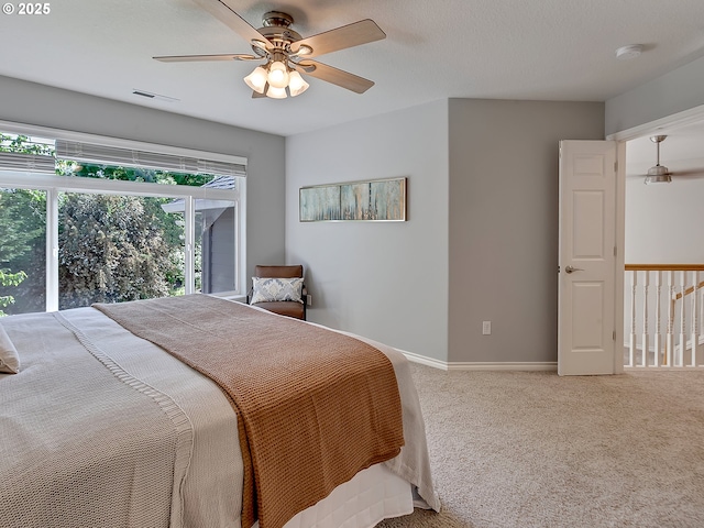 bedroom with carpet floors, a ceiling fan, and baseboards