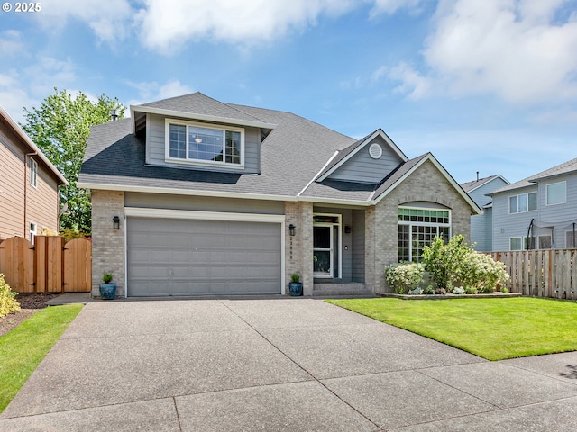 traditional home featuring brick siding, concrete driveway, a shingled roof, and an attached garage