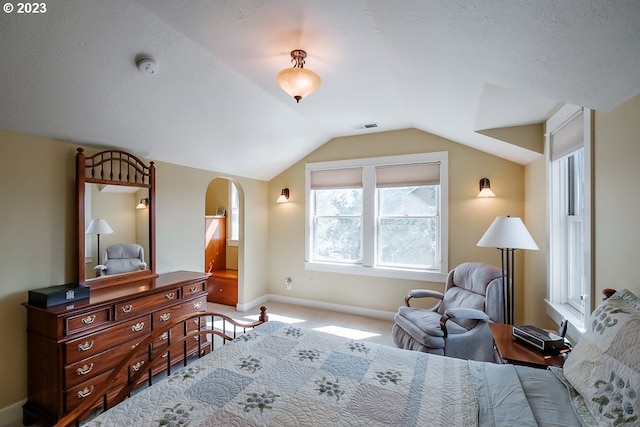 1603 Berkeley Ln, Monmouth, OR 97361 - carpeted bedroom featuring baseboards, lofted ceiling, and arched walkways