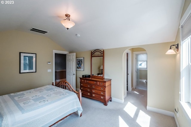 1603 Berkeley Ln, Monmouth, OR 97361 - bedroom featuring lofted ceiling, arched walkways, light colored carpet, and baseboards