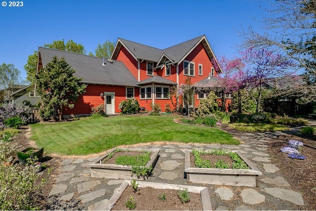 1603 Berkeley Ln, Monmouth, OR 97361 - rear view of property featuring a garden and a lawn