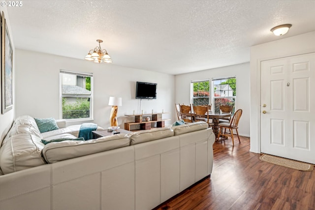 19030 SW Pike Ln, Beaverton, OR 97078 - living area with a textured ceiling, dark wood-style flooring, and a chandelier