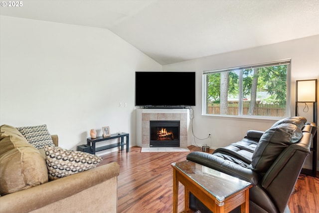 19030 SW Pike Ln, Beaverton, OR 97078 - living area with vaulted ceiling, wood finished floors, and a fireplace
