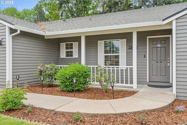 19030 SW Pike Ln, Beaverton, OR 97078 - property entrance with covered porch and a shingled roof