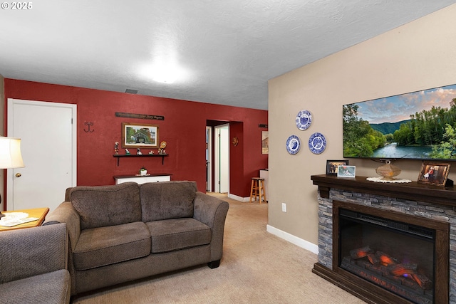 carpeted living room featuring a textured ceiling and a fireplace