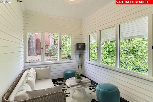 2566 NW Lovejoy St Unit 4, Portland, OR 97210 - sunroom with healthy amount of natural light, wooden walls, and wooden ceiling