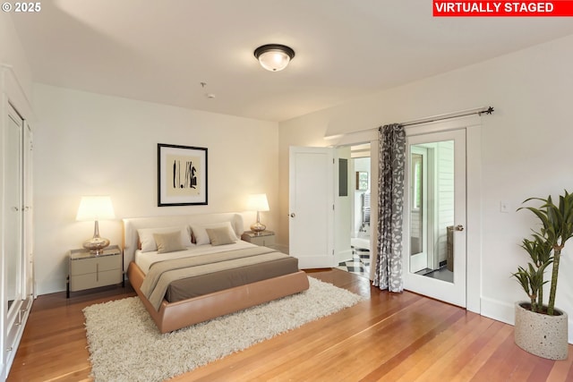 2566 NW Lovejoy St Unit 4, Portland, OR 97210 - bedroom with wood finished floors and baseboards