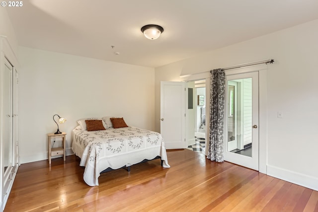 2566 NW Lovejoy St Unit 4, Portland, OR 97210 - bedroom featuring wood finished floors and baseboards