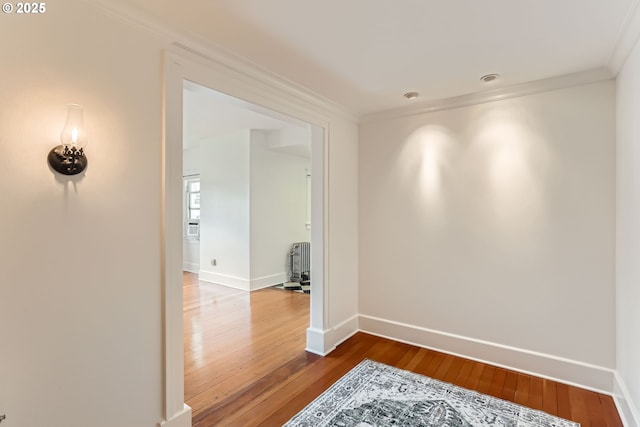 2566 NW Lovejoy St Unit 4, Portland, OR 97210 - corridor featuring crown molding, wood-type flooring, and baseboards