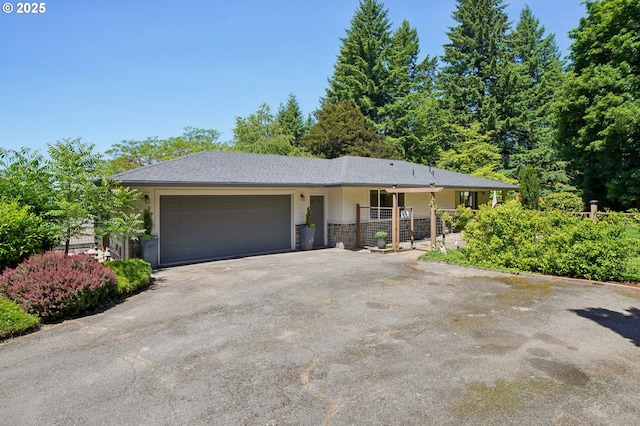 15785 SW Bull Mountain Rd, Portland, OR 97224 - ranch-style home with asphalt driveway and a garage