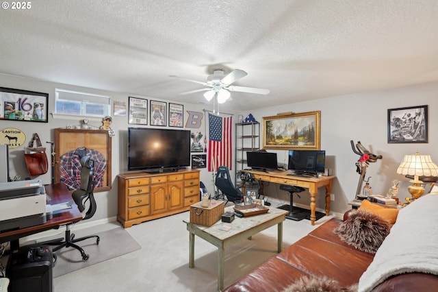 15785 SW Bull Mountain Rd, Portland, OR 97224 - living room featuring a desk, a ceiling fan, a textured ceiling, baseboards, and light carpet