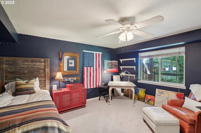 15785 SW Bull Mountain Rd, Portland, OR 97224 - carpeted bedroom featuring a textured ceiling, a ceiling fan, and baseboards