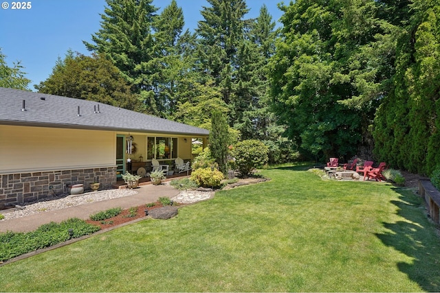 15785 SW Bull Mountain Rd, Portland, OR 97224 - view of grassy yard with an outdoor fire pit and a patio