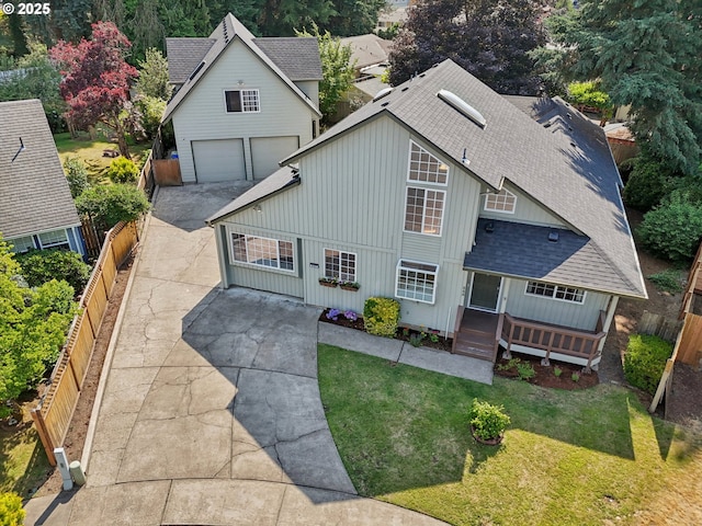 243 N 30th Ct, Cornelius, OR 97113 - view of front of home with a shingled roof, board and batten siding, concrete driveway, and a fenced backyard