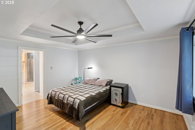 243 N 30th Ct, Cornelius, OR 97113 - bedroom featuring a raised ceiling, light wood-style flooring, ornamental molding, and ceiling fan