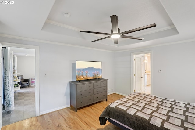 243 N 30th Ct, Cornelius, OR 97113 - bedroom featuring a tray ceiling, light wood-style floors, crown molding, and a ceiling fan